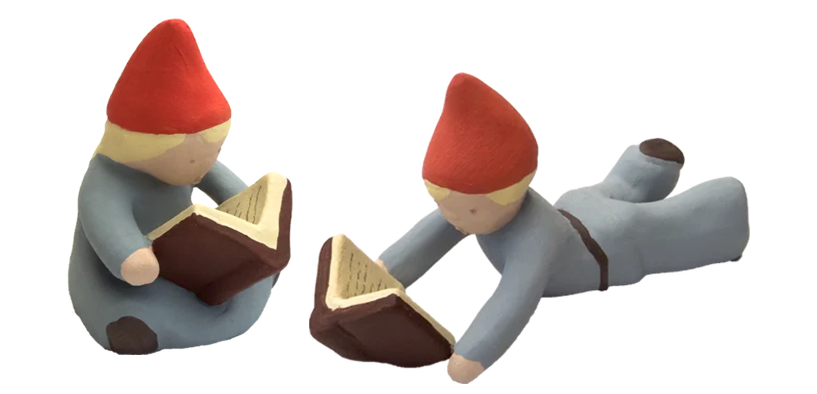Två nya figurer: tomteflicka och tomtepojke som läser